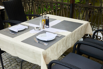 Outdoor restaurant table on terrace with river view
