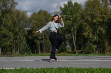 Caucasian woman roller skating in park. 