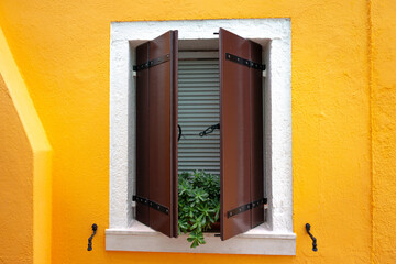 Colorful houses on the island of Burano, drying laundry