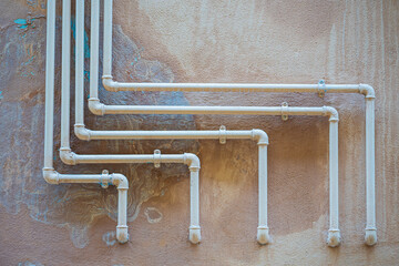 Pipes sticking out of the wall in Italian houses