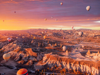 Amazing Cappadocia beautiful landscape with hot air balloons at sunrise, aerial view