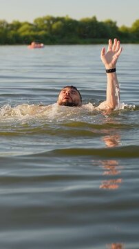 Man drowning in lake and asking for help
