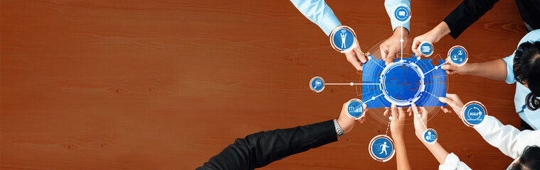 A diverse team collaborates over a digital workspace, utilizing modern tools and icons that symbolize creativity and connectivity, fostering an environment of innovation. Amity