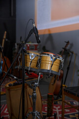 Percussion Setup with Bongos and Microphones in Music Studio