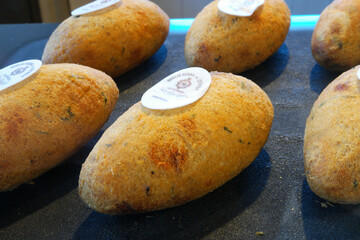 Delicious bolinhos de bacalhau on display in Lisbon, Portugal, showcasing a popular local delicacy in European cuisine