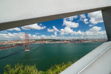Expansive view overlooking Lisbon from the Cristo Rei viewpoint, showcasing the iconic 25 de Abril Bridge