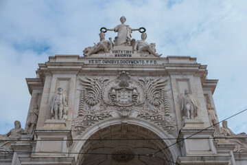 Exploring the grandeur of Arco da Rua Augusta in Lisbon, Portugal, showcasing intricate architecture and historic significance