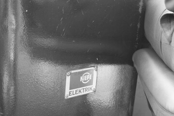 Lissabon tram line detail showcasing classic electric features in black and white