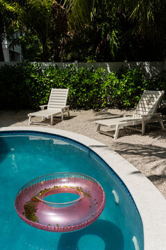 Lounge chairs and float at the pool