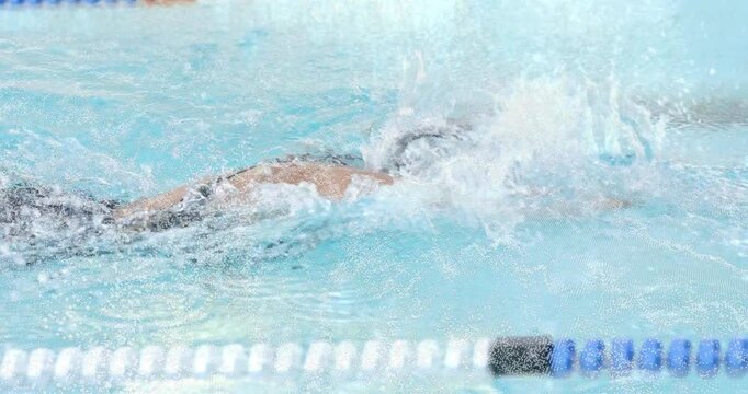 Female swimmer performing crawl stroke in lap pool for training with animated speed graph overlay