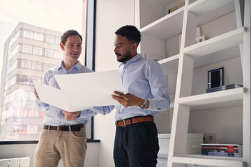 Business colleagues discussing project plans in office