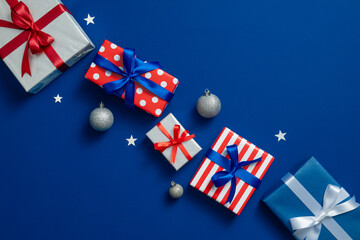 Colorful Christmas Gifts With Bows On Blue Background