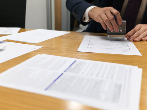 Lawyer Professional Stamping Documents on Office Desk