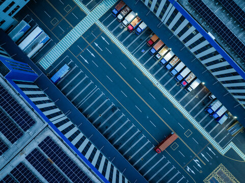 Warehouse and Truck Logistics Aerial View at Night