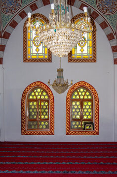Elegant Interior With Stained Glass Windows and Ornate Chandelier