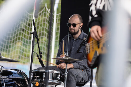 Drummer and bass player performing on the summer stage