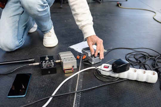 Setting up guitar pedals before a performance