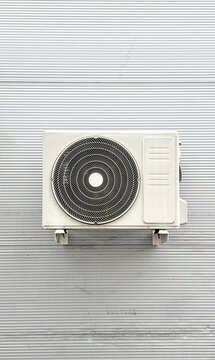 White Air Conditioner on Gray Wall
