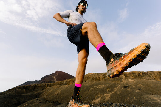 Trail runner taking a stride as part of his outdoor mobility training