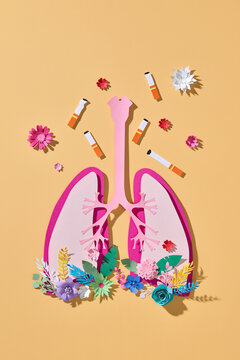 Paper art lungs with cigarettes and flowers - anti smoking concept