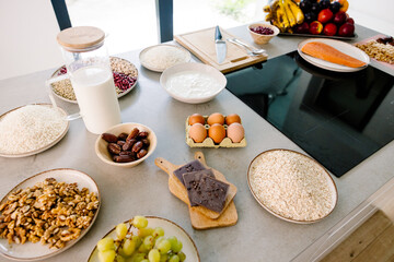 Kitchen table with fresh ingredients for preparing salmon