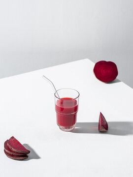 Delicious beetroot juice served in a glass and with beet slices
