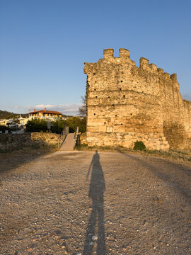 Female's shadow next to Acropolis wall