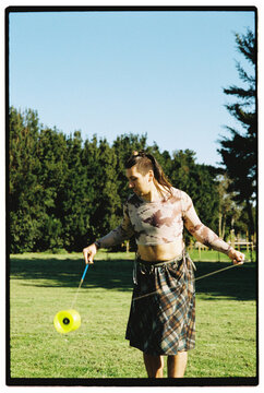 Non-binary Person Performing Diabolo