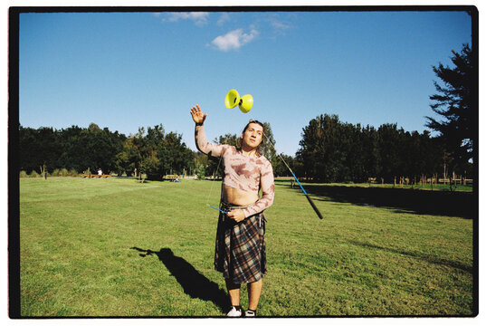 Expressive Diabolo Trick in Mid-Air by Non Binary Artist