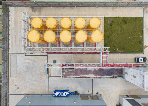 Aerial View of Industrial Storage Tanks on Concrete Ground