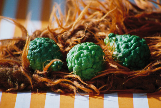 Lime arranged on a textured brown mat