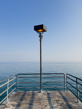 Street Slight on the End of Lake Erie Pier with Water Flowing Behind
