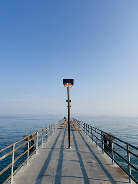 Fototapeta Wide Angle Center Perspective of Streetlights on Lake Erie Pier