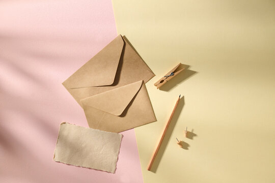 Elegant Paper Stationery Set Arranged on Dual Colored Backdrop