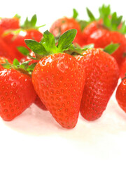 Fresh and juicy red strawberry on white background. Premium high quality organic product. Food supply industry. Close up details shot.