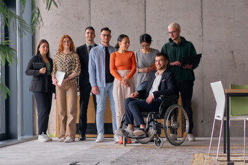 Fototapeta premium Multiethnic Business Team Collaborating in a Modern Office with Director in a Wheelchair