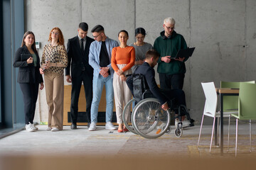 Multiethnic Business Team Collaborating in a Modern Office with Director in a Wheelchair