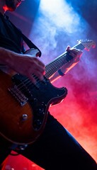 Obraz premium Intense close-up of electric guitar at vibrant rock concert