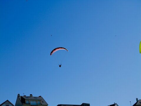 Paragliders (paragliding) near the French coast of the North Atlantic Ocean. Lower Normandy, France