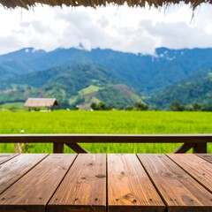 Rustic wooden table overlooking a rice paddy and mountains