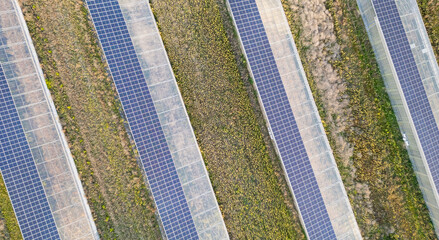 Aerial view of modern solar greenhouses with photovoltaic panel roofs, sustainable agriculture and renewable energy integration for eco farming and clean power production