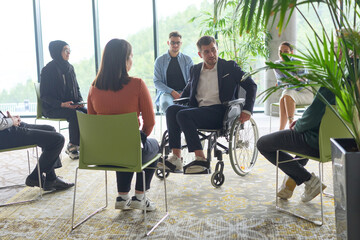 Corporate business team meeting with a manager or coach. Group of happy diverse, multiracial people...