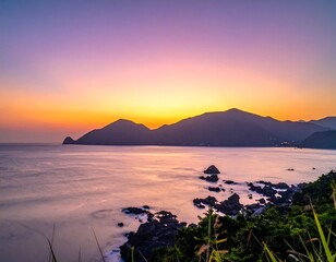 Scenic coastal sunrise over mountains