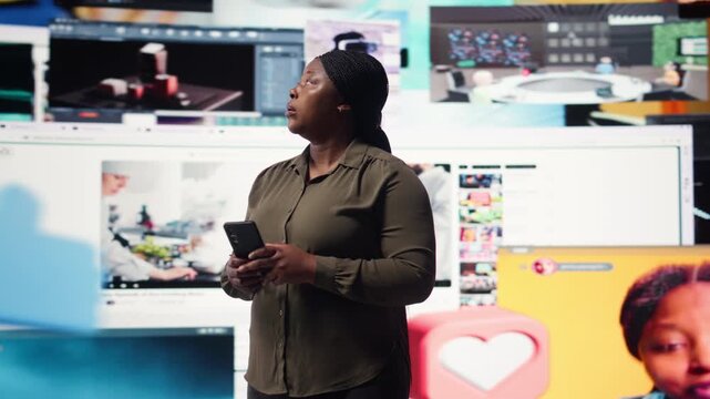 Woman using smartphone surrounded by curated video recommendations while browsing streaming services. Person enjoying free time browsing favorite online clips on phone, camera A