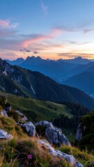 Obraz premium Mountain vista at sunset. Rolling hills, rocky terrain, wildflowers, vibrant colors, distant peaks