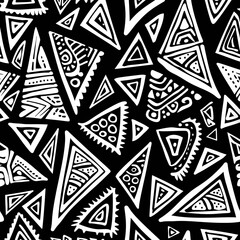 A black and white seamless pattern featuring various sizes and styles of intricately decorated triangles