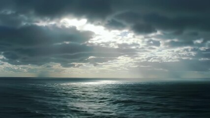 Sunbeams Break Through Stormy Sea.