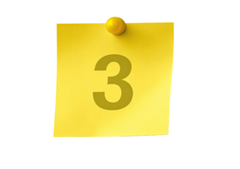 Yellow sticky note with the number three pinned to a surface