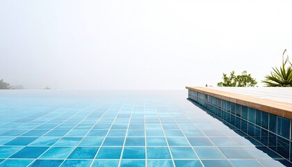 Obraz premium Serene Blue Infinity Pool Overlooking Misty Ocean
