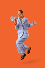 Young happy businesswoman with megaphone jumping on orange background